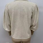 Beige women's blazer with puffed sleeves, tailored fit, and textured fabric, ideal for professional and casual occasions.