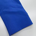 Close-up of a vibrant blue fabric sleeve with clean stitching and smooth texture, ideal for fashion or clothing design.