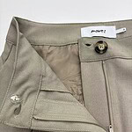 Close-up of beige women's trousers with button and zipper closure, showcasing high-quality fabric and tailored fit, ideal for stylish office wear or casual outings.