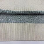 Detailed close-up of fabric textures showing different knit patterns and colors, highlighting quality textile craftsmanship.
