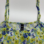 Colorful floral summer dress with adjustable shoulder straps, featuring a vibrant pattern of blue, yellow, and green flowers on lightweight fabric.
