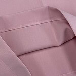 Close-up of a pink fabric bag with a smooth texture and stitched edges, ideal for storing fashion accessories or personal items.