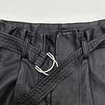 Close-up of stylish men's black leather pants with a belt and zipper, suitable for fashion and casual wear.