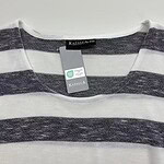 Close-up of a gray and white striped T-shirt with a Kapalua tag, suitable for casual fashion and everyday wear.