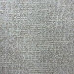 Close-up of beige textured fabric with a subtle woven pattern, ideal for fashion and upholstery projects.