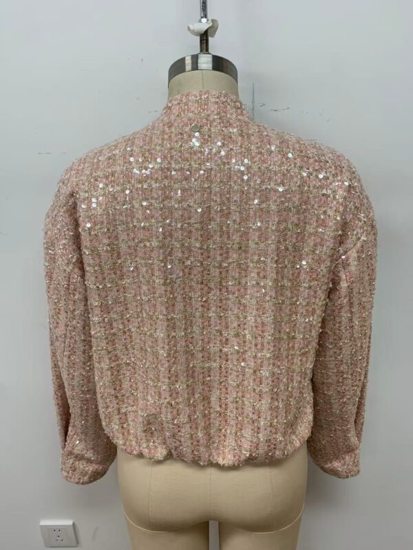 Pink sequin blouse with long sleeves and high neckline, perfect for special occasions or evening wear.