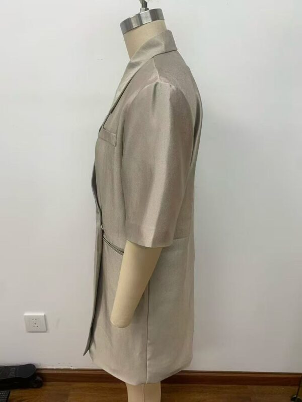 Stylish beige women's coat displayed on a mannequin, perfect for fall fashion, featuring a tailored fit and knee-length design.
