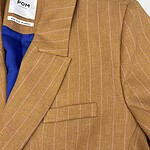 Elegant brown pinstripe blazer with a tailored fit, featuring a notched lapel and a single front pocket, perfect for professional or casual wear.