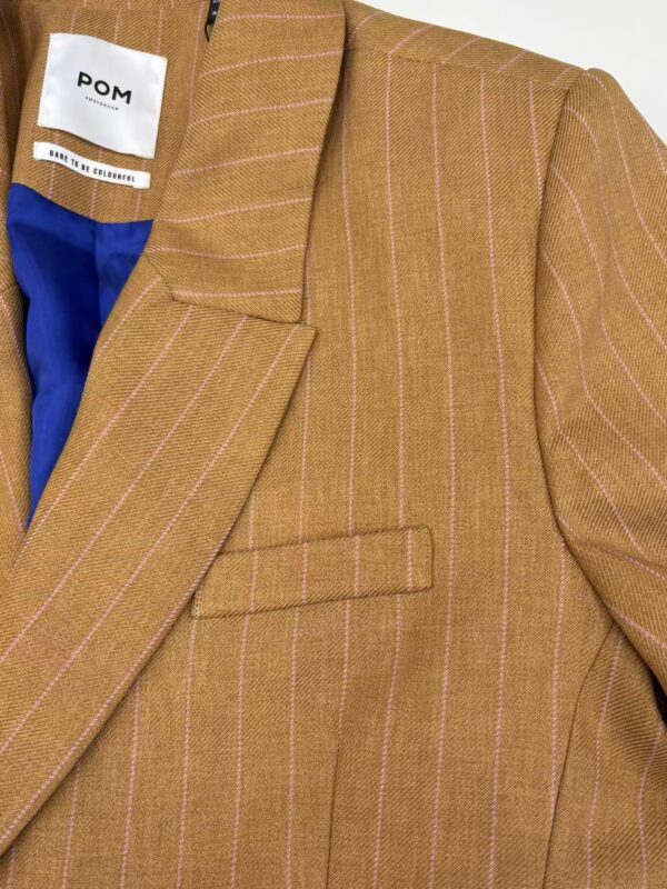 Elegant brown pinstripe blazer with a tailored fit, featuring a notched lapel and a single front pocket, perfect for professional or casual wear.