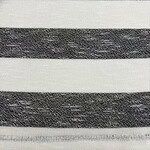Close-up of black and white striped fabric, showcasing texture and pattern suitable for fashion design and clothing.