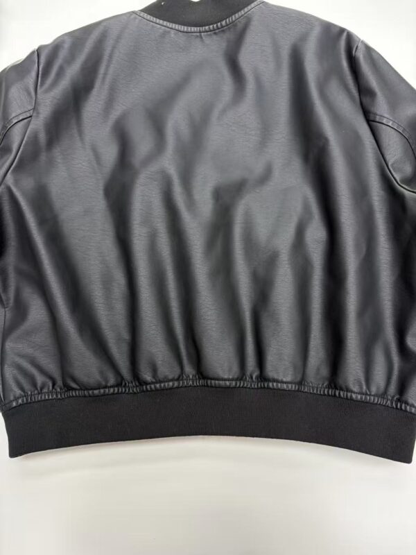 Stylish black leather bomber jacket with ribbed cuffs and waistband, perfect for casual and streetwear fashion.