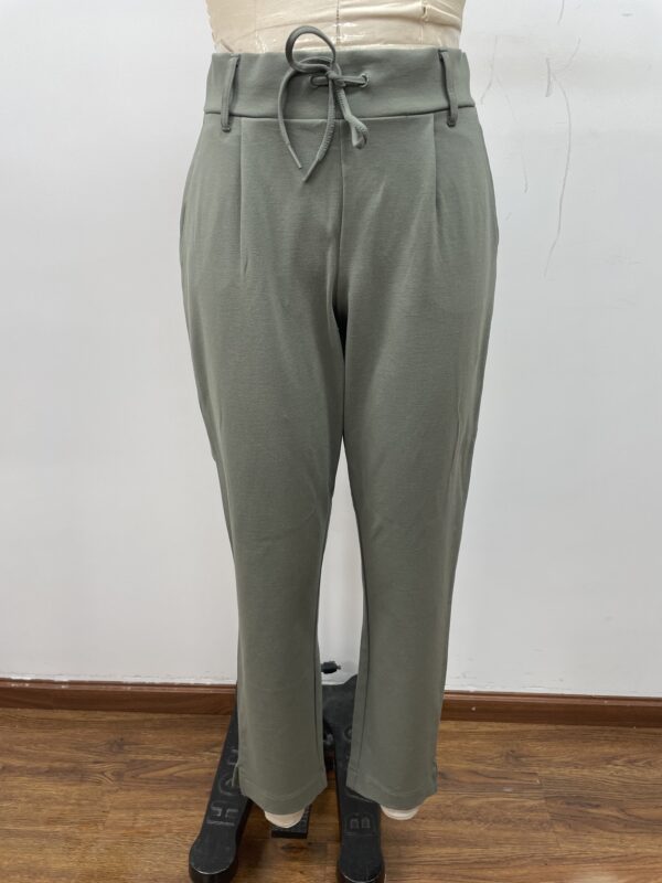 Stylish women's trousers with a drawstring waist, tailored fit, and soft fabric, perfect for casual or office wear.