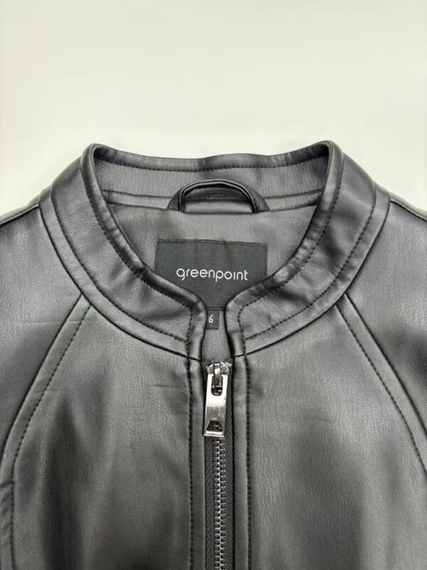 Close-up of a stylish black leather jacket with a silver zipper and round neckline, perfect for men's fashion and casual wear.