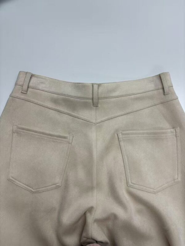 Close-up of beige casual pants with back pockets, suitable for everyday wear and fashion styling.