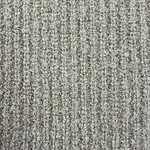 Close-up of a beige textured carpet with a loop pile pattern, ideal for modern home or office decor.