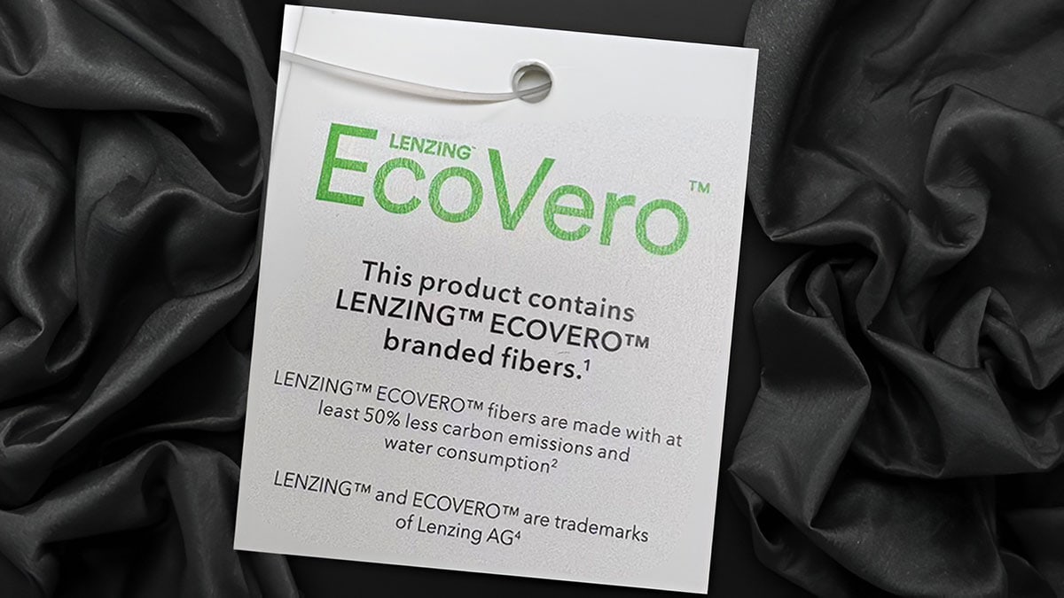 Close-up of EcoVero fabric label highlighting eco-friendly fibers and branding details for sustainable apparel manufacturing.