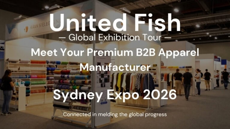 Exhibition booth at Sydney Expo 2026 showcasing premium B2B apparel manufacturing with colorful fabric rolls and apparel displays.