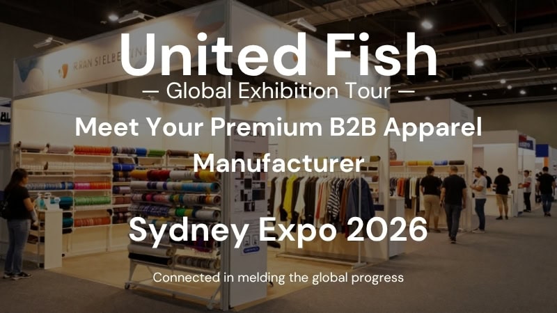 Exhibition booth at Sydney Expo 2026 showcasing premium B2B apparel manufacturing with colorful fabric rolls and apparel displays.